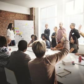 Group of people in a conference room talking