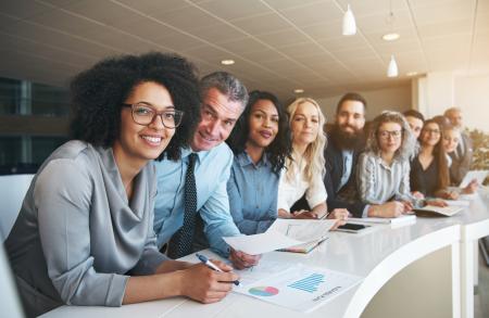Group of people as a table looking in same direction